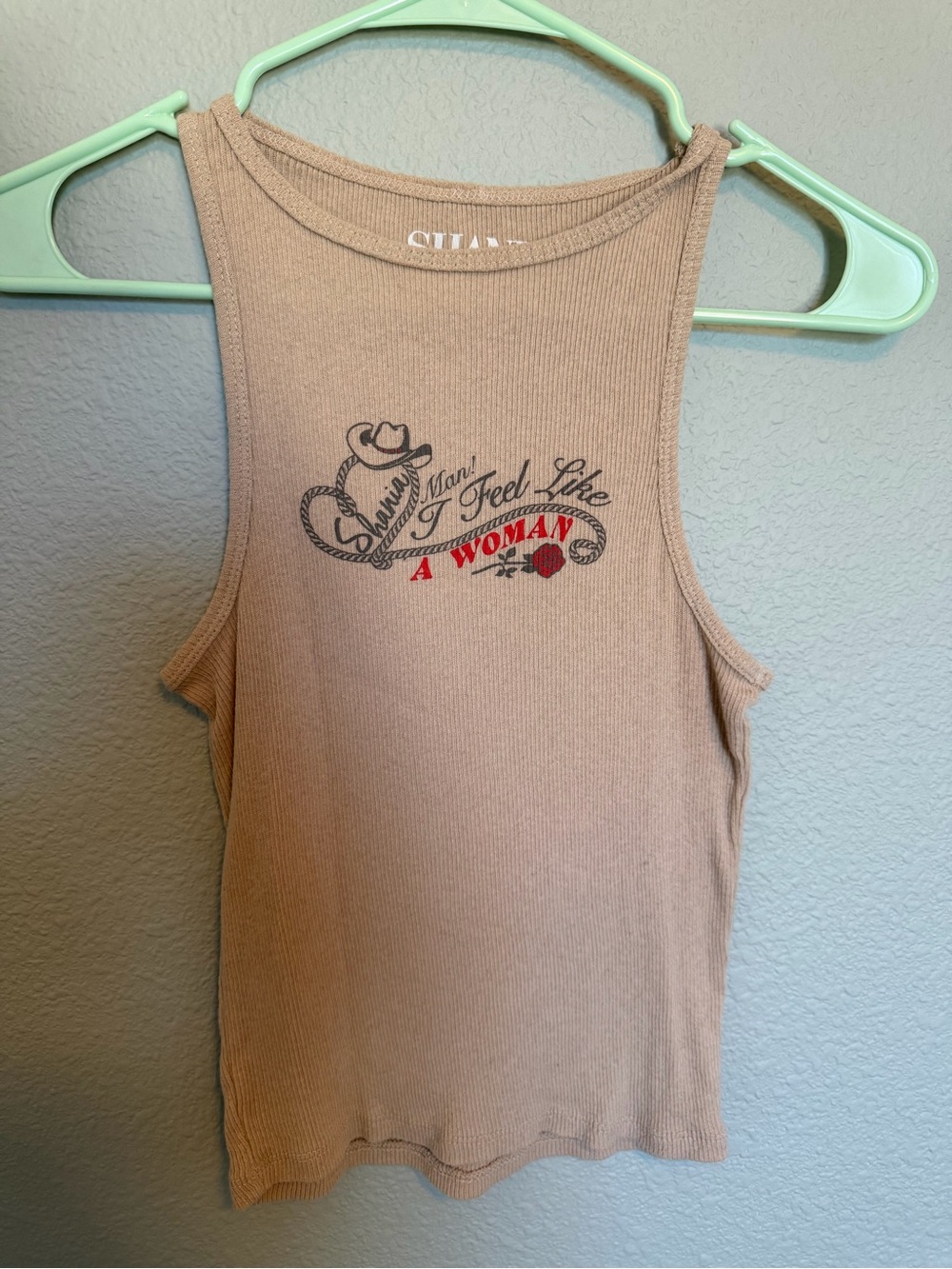 Shania Twain Beige Ribbed Muscle Tank with 'I Feel Like A Woman' Graphic